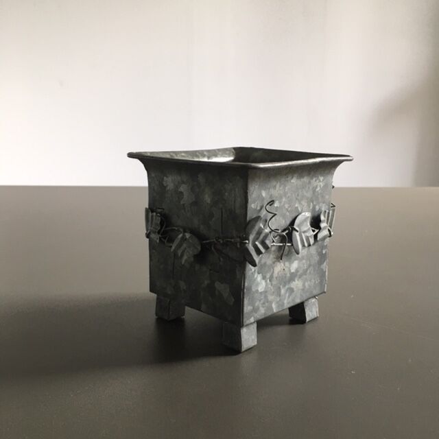 Galvanized flowerpot with ivy decor