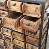 Black metal storage cabinet with 60 wooden drawers