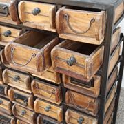 Black metal storage cabinet with 60 wooden drawers