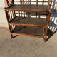 Wicker stand with scrolls shelf