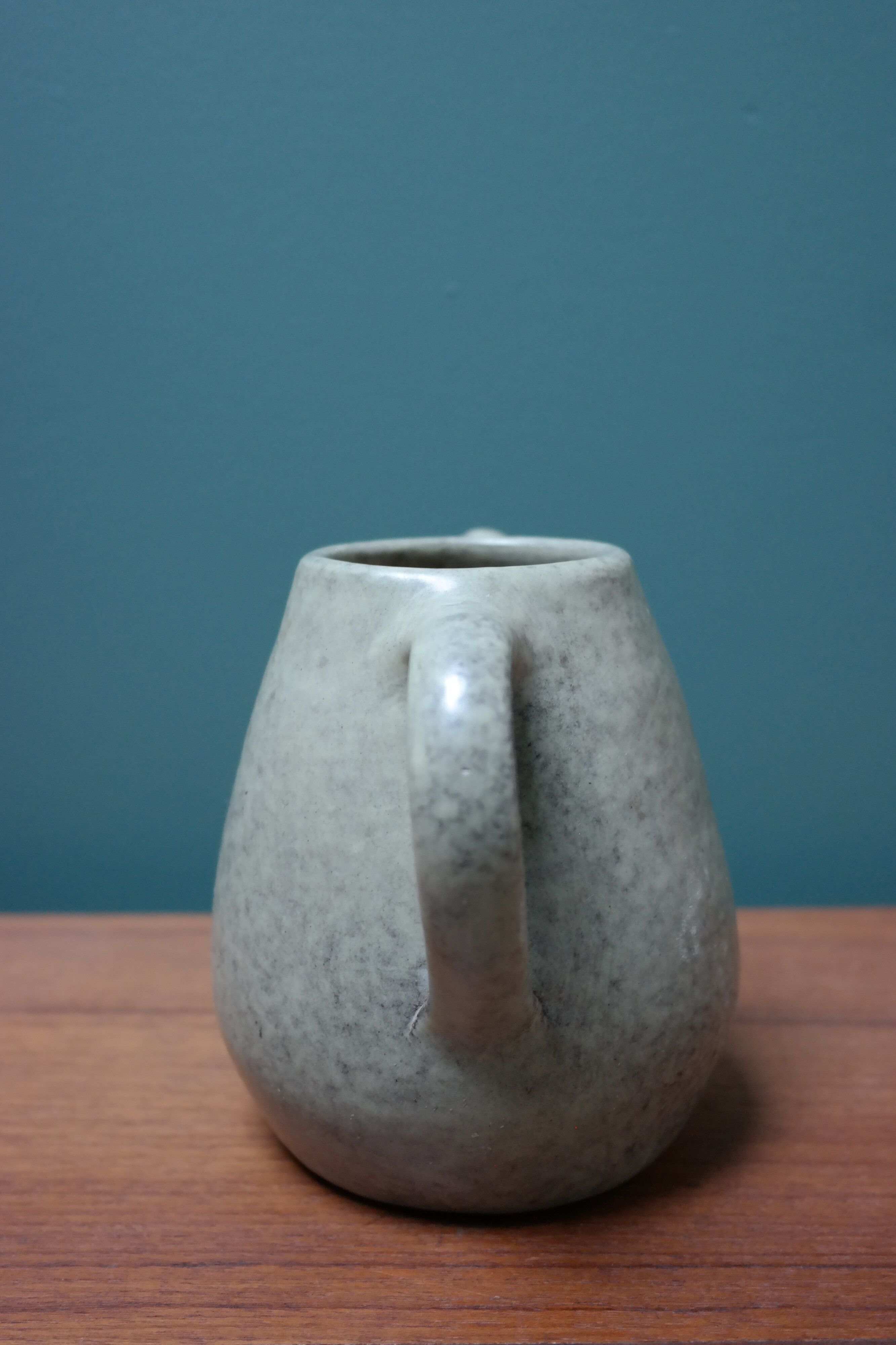 Small ceramic pitcher enamelled pale green, signed Max Idlas