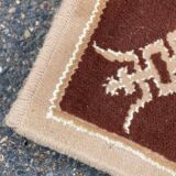 Persian rug in beige wool with woven flowers 290x190cm