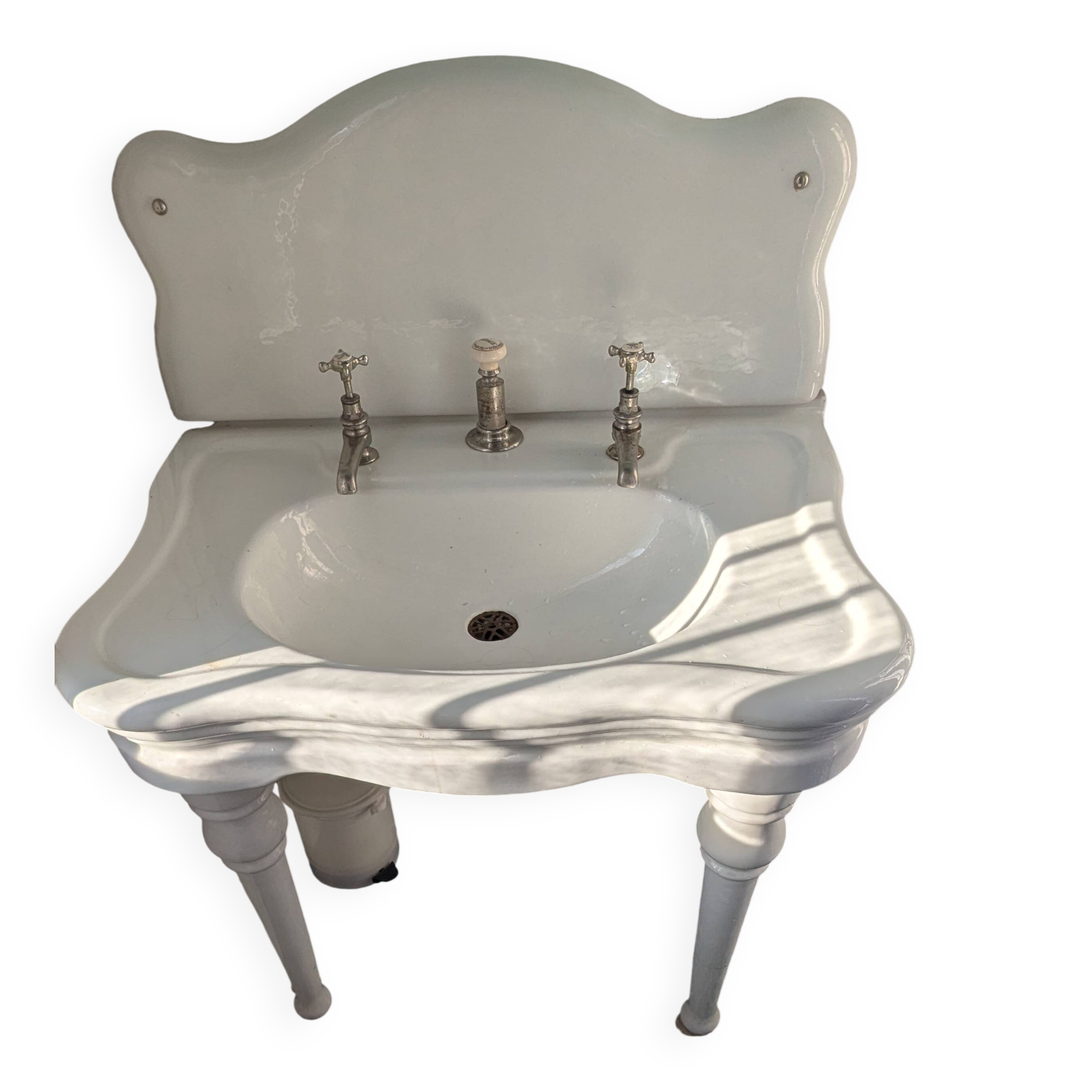Set of a sink and its retro ceramic splashback.