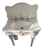 Set of a sink and its retro ceramic splashback.