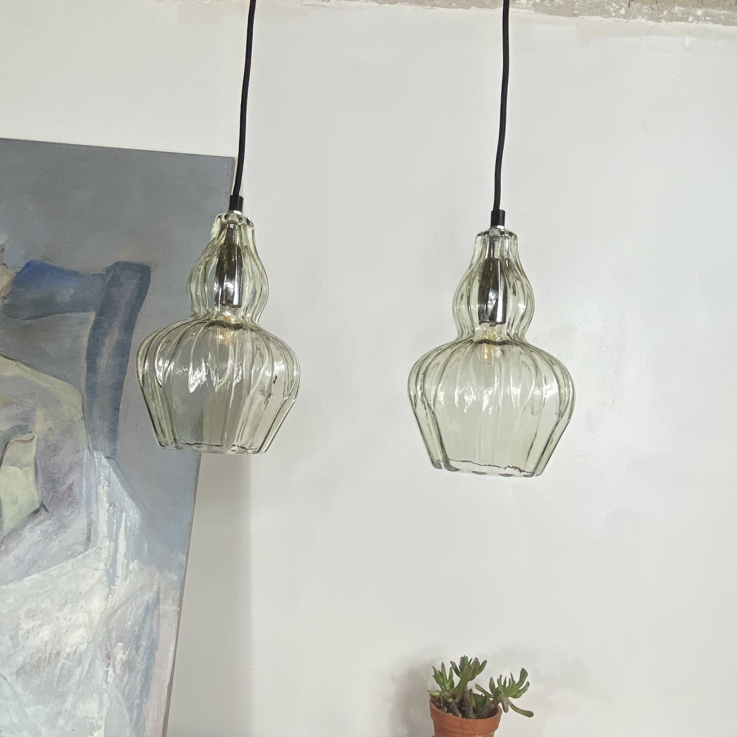 Pair of vintage glass pendant lights.