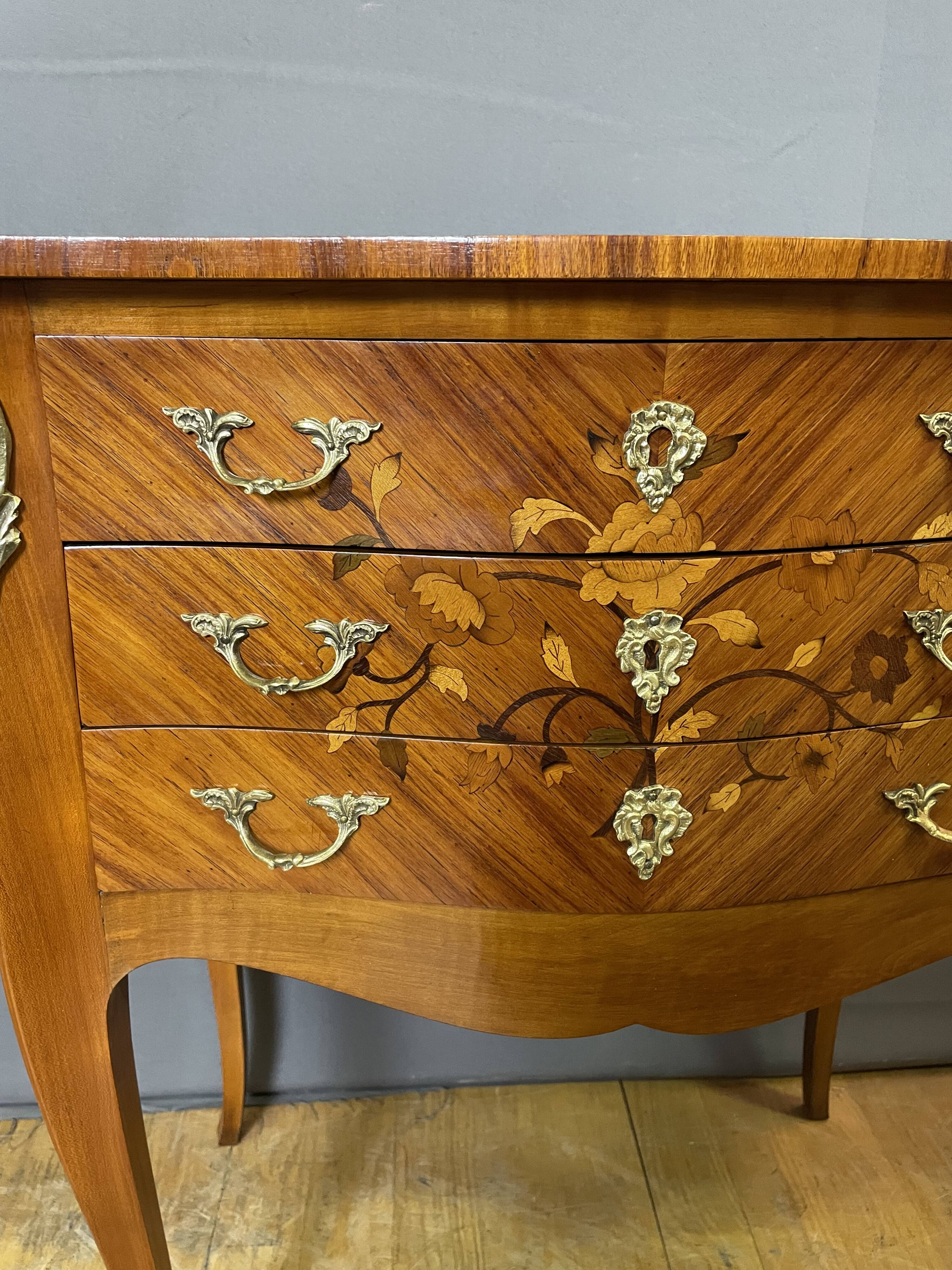 Pair of Louis XV style bedside tables in rosewood marquetry.