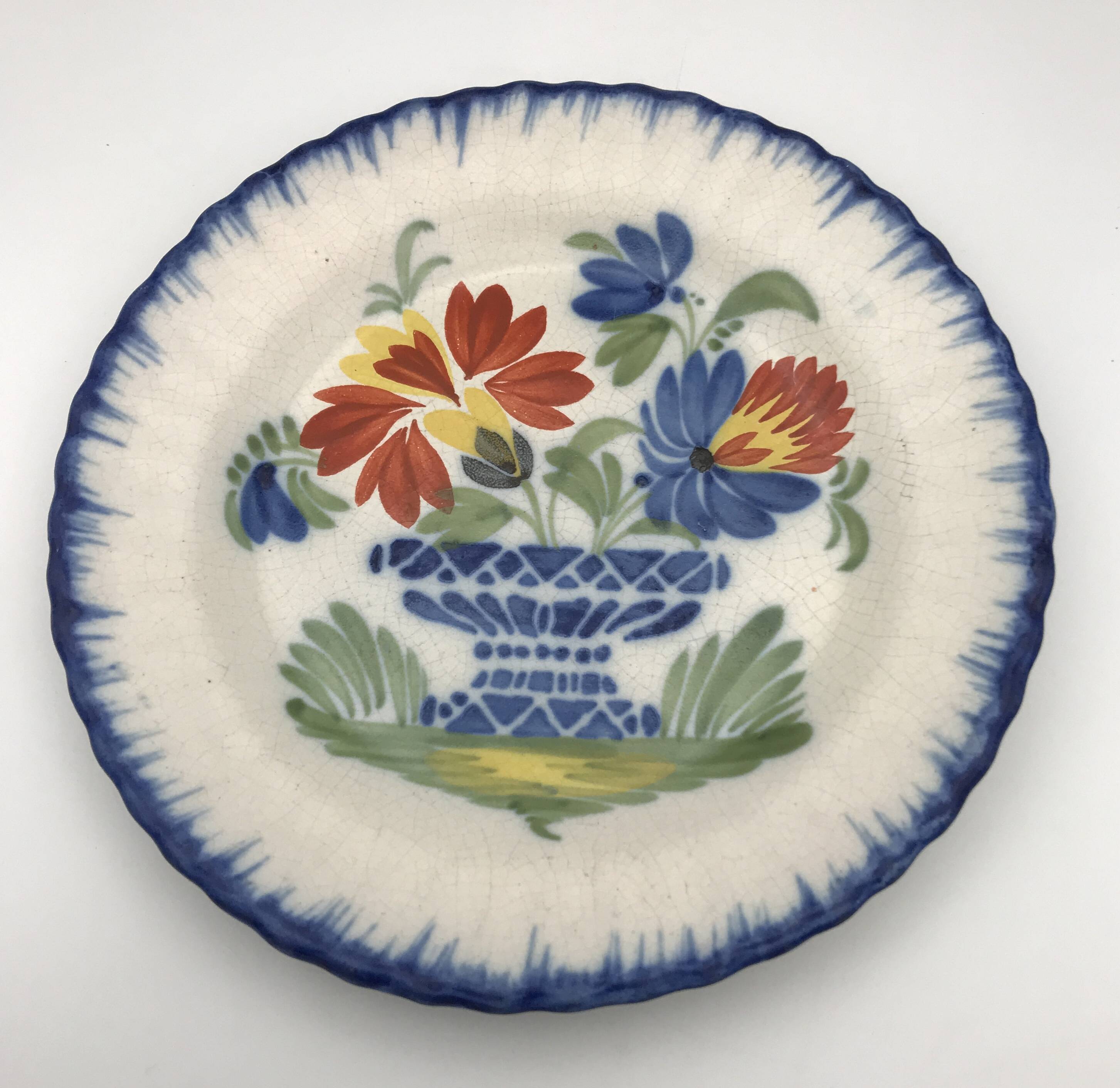 Antique auvillar earthenware plate decorated with basket of polychrome flowers