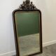 Antique 1800s black and gold mirror with cupid, France 1800s.
