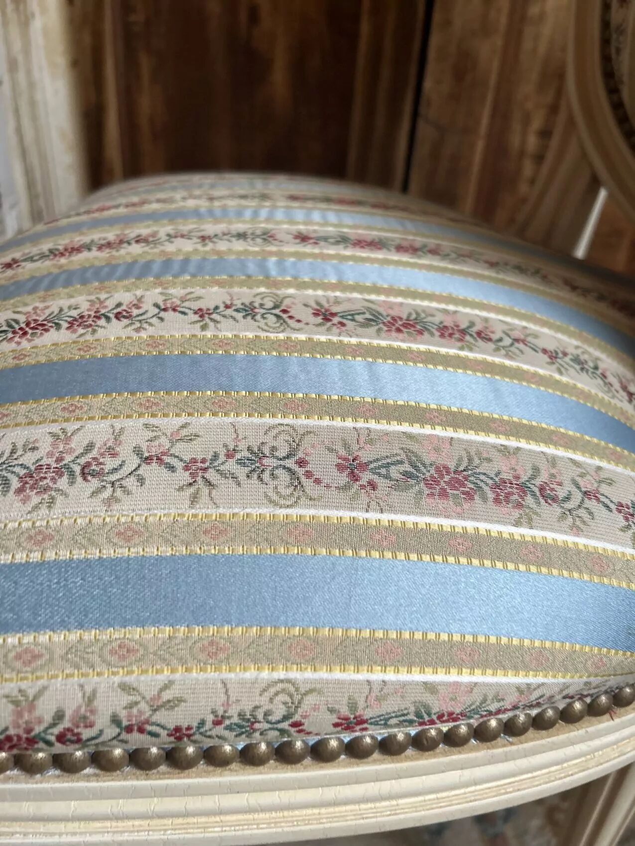 Pair of Louis XVI style chairs in painted wood and satin, classic elegance.