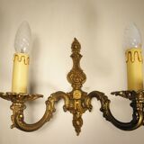Pair of two-light wall lights in gilded bronze