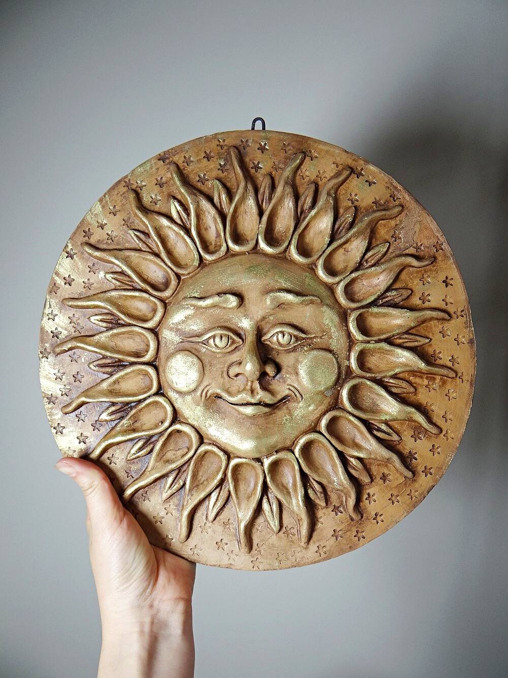 Anthropomorphic sun wall sculpture in patinated terracotta, vintage Italian craftsmanship.