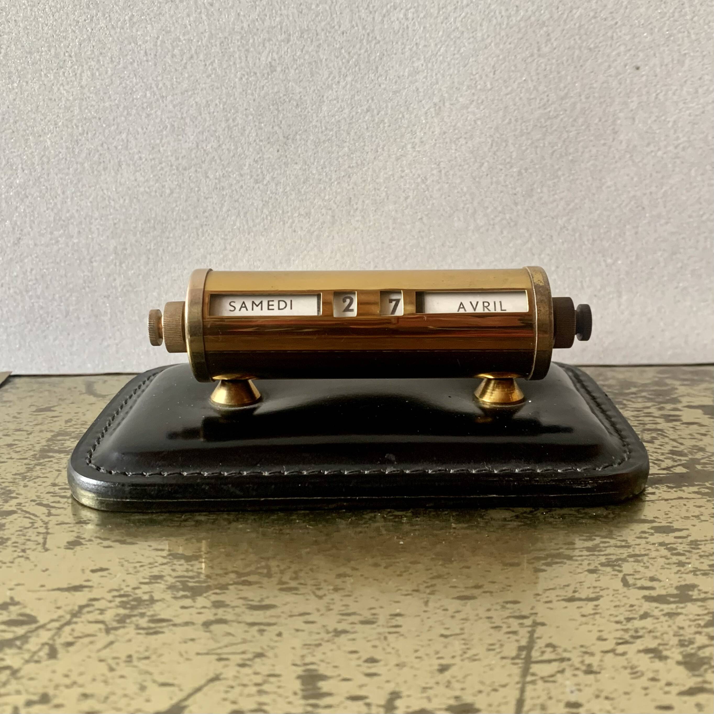 Old perpetual calendar in leather and brass