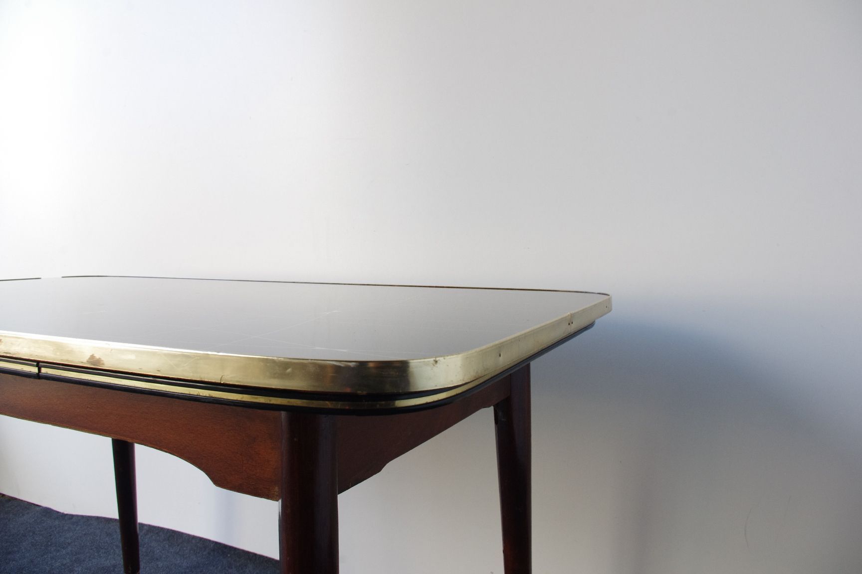Folding table with black and gold painted glass, 1950