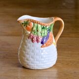 Hand-painted earthenware carafe with a raised vegetable basket design