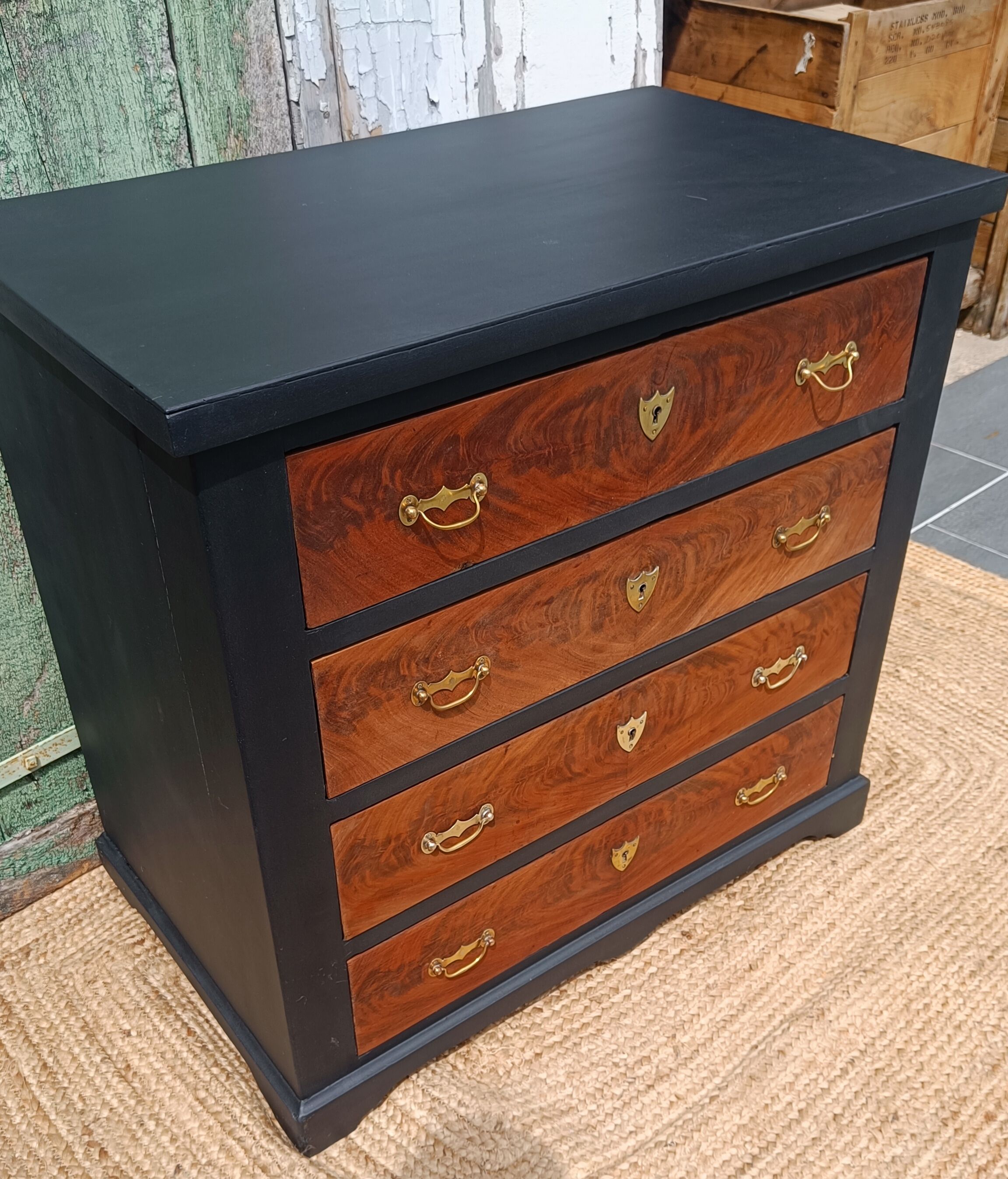 Vintage commode revamped in matte black & wood with warm tones.