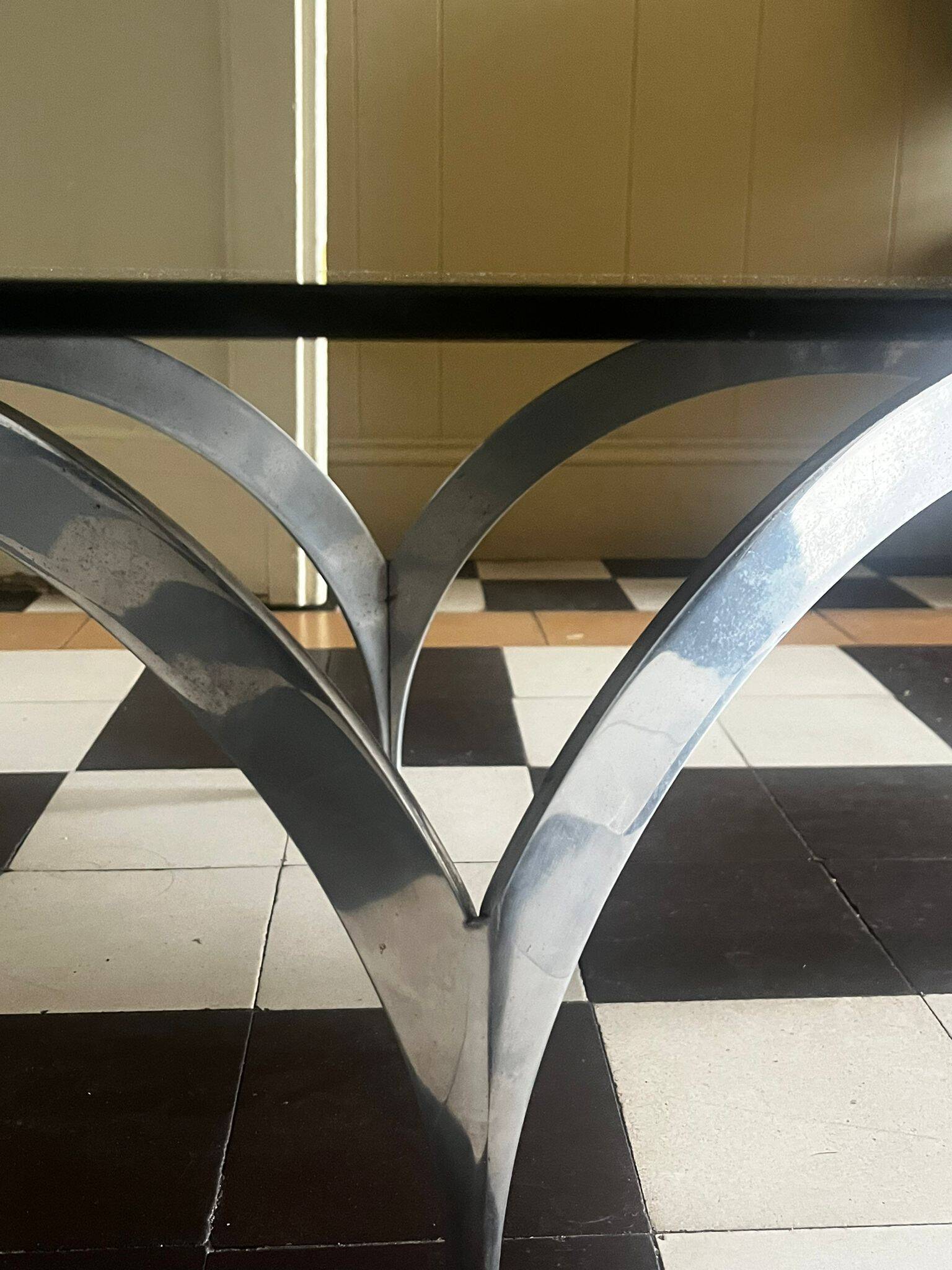 coffee table with metal legs and smoked glass top