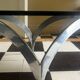 coffee table with metal legs and smoked glass top