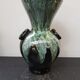 Old black enamelled ceramic Gaubier vase with green white vintage drips