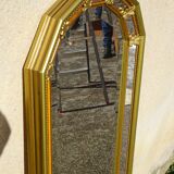 Hall mirror, gilded frame with fillets and fleur-de-lis.