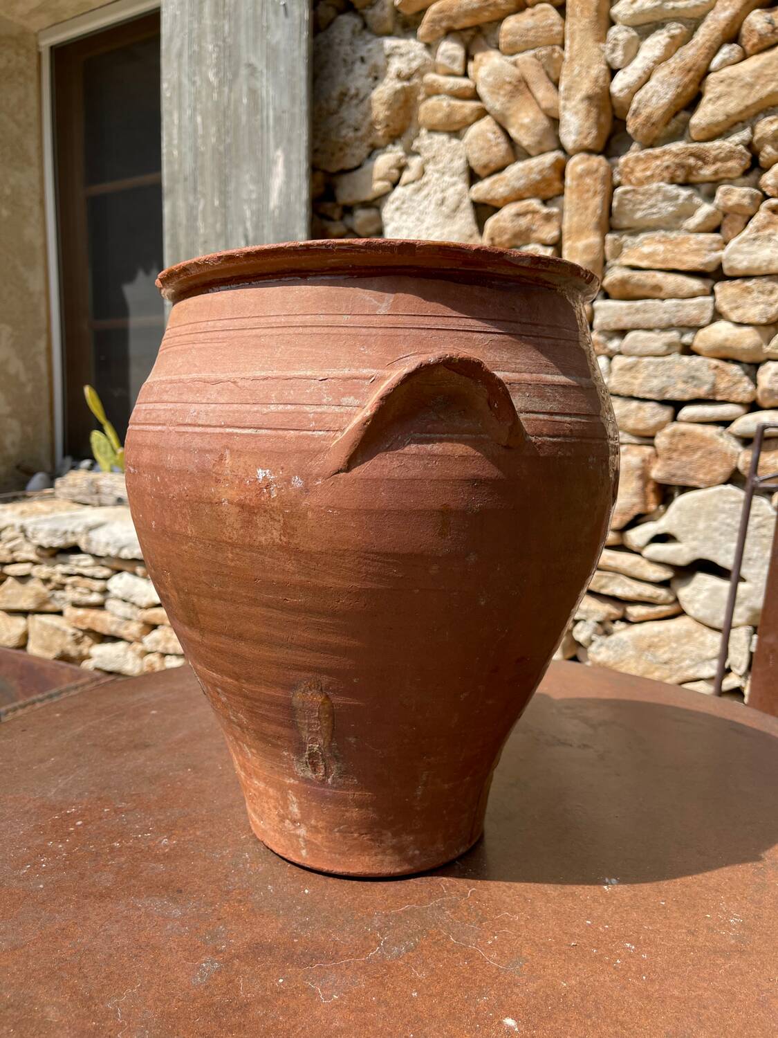 Ancient terracotta pottery jar