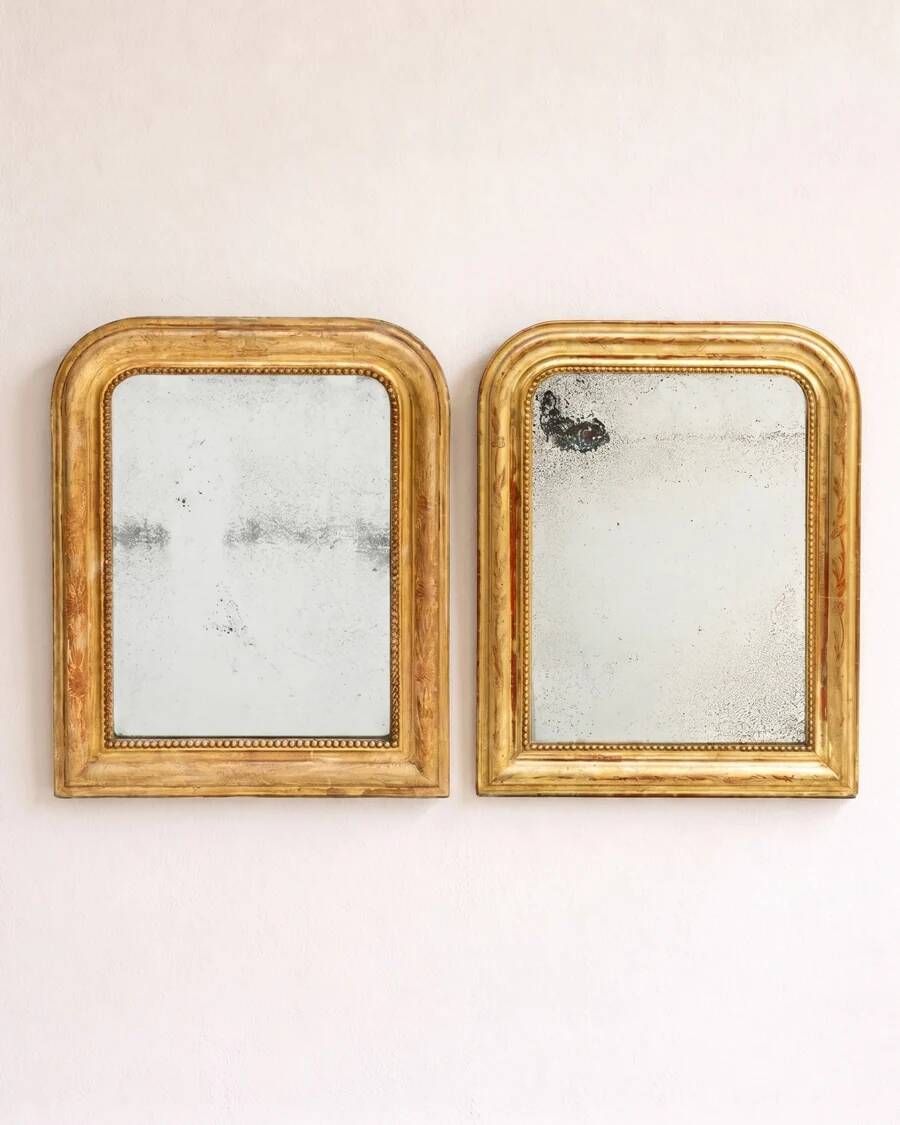 Set of two small French Louis-Philippe gilt red mirrors from the 19th century.