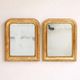 Set of two small French Louis-Philippe gilt red mirrors from the 19th century.