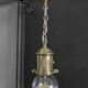 Brass pendant light with oversized LED bulb