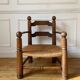 Straw and turned wood fireplace armchair in the style of Charles Dudouyt