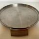 Large flat metal and wood platter in Scandinavian style.