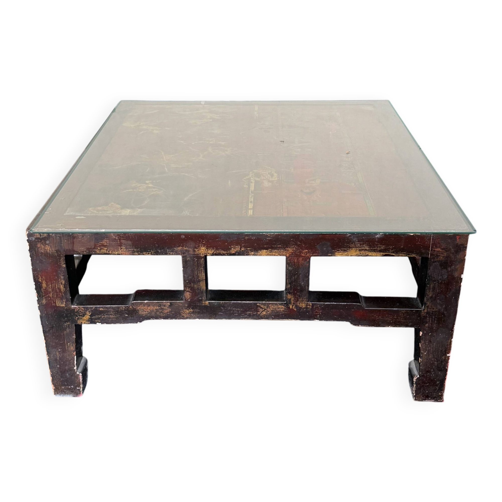 Vintage brutalist coffee table with Asian decor.