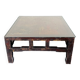 Vintage brutalist coffee table with Asian decor.