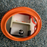 Mirror with round frame in orange molded plastic by carrara & matta, 1974