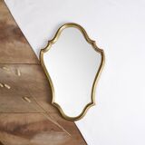Old wooden mirror gilded with gold leaf