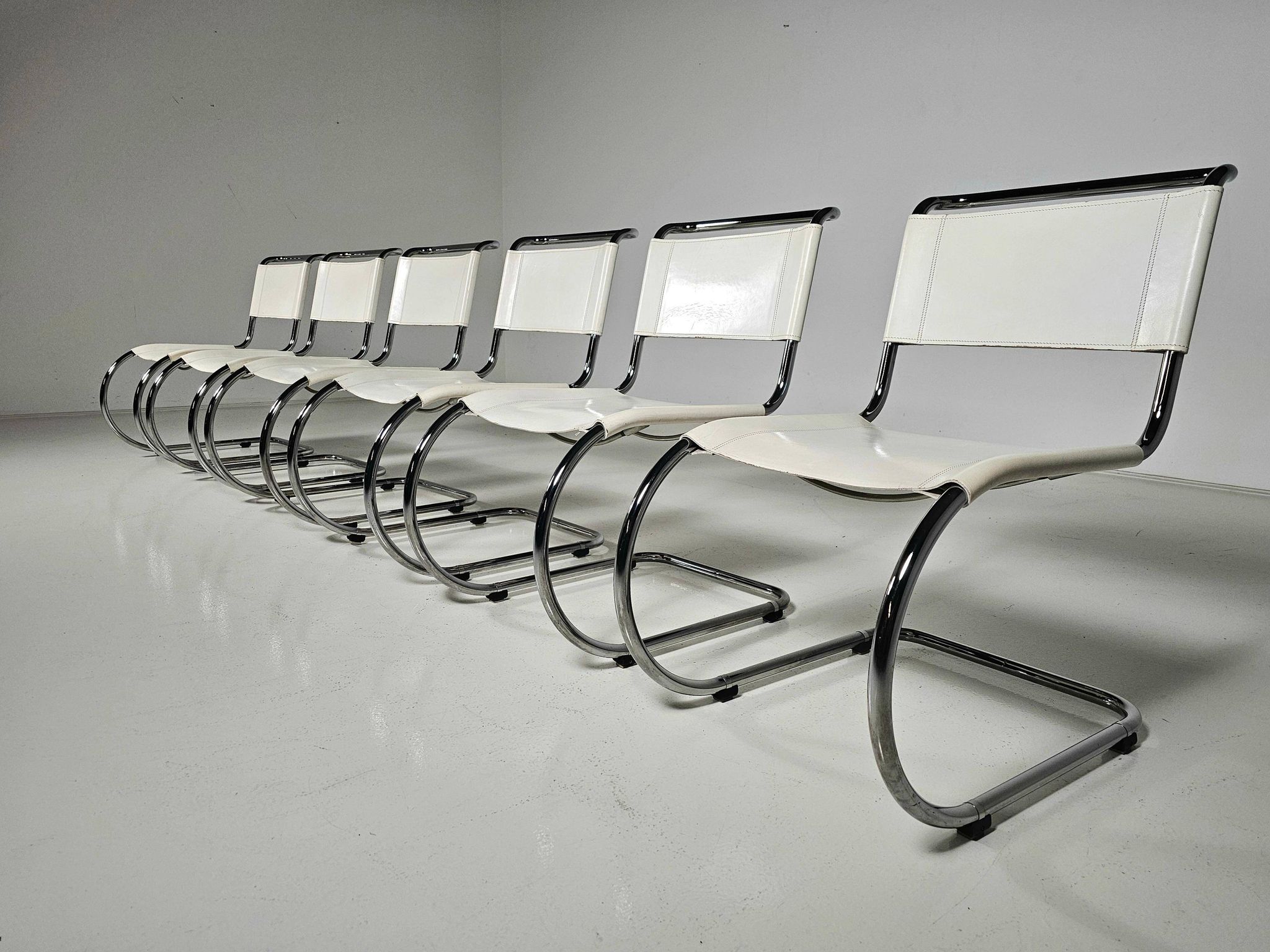 Set of 6 white cantilever dining chairs MR10 by Mies van der Rohe for Thonet, 1980s.