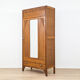 Art Deco wardrobe in carved wood with mirror from the 1930s.