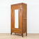 Art Deco wardrobe in carved wood with mirror from the 1930s.