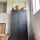Old wooden locker with black patina