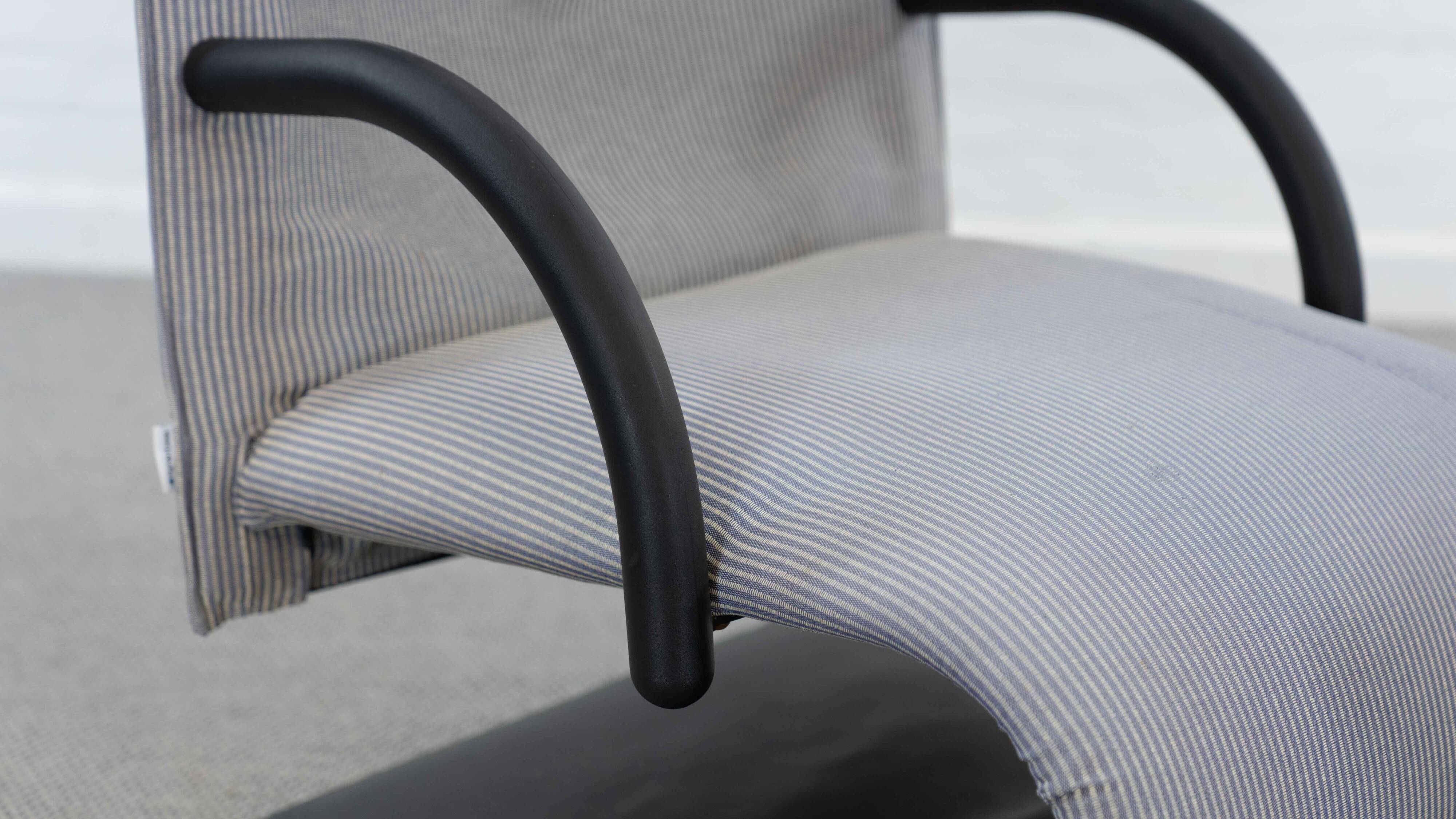 Zen easy chair with footrest by claude brisson for ligne roset