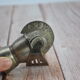 Old silver metal pouring cap