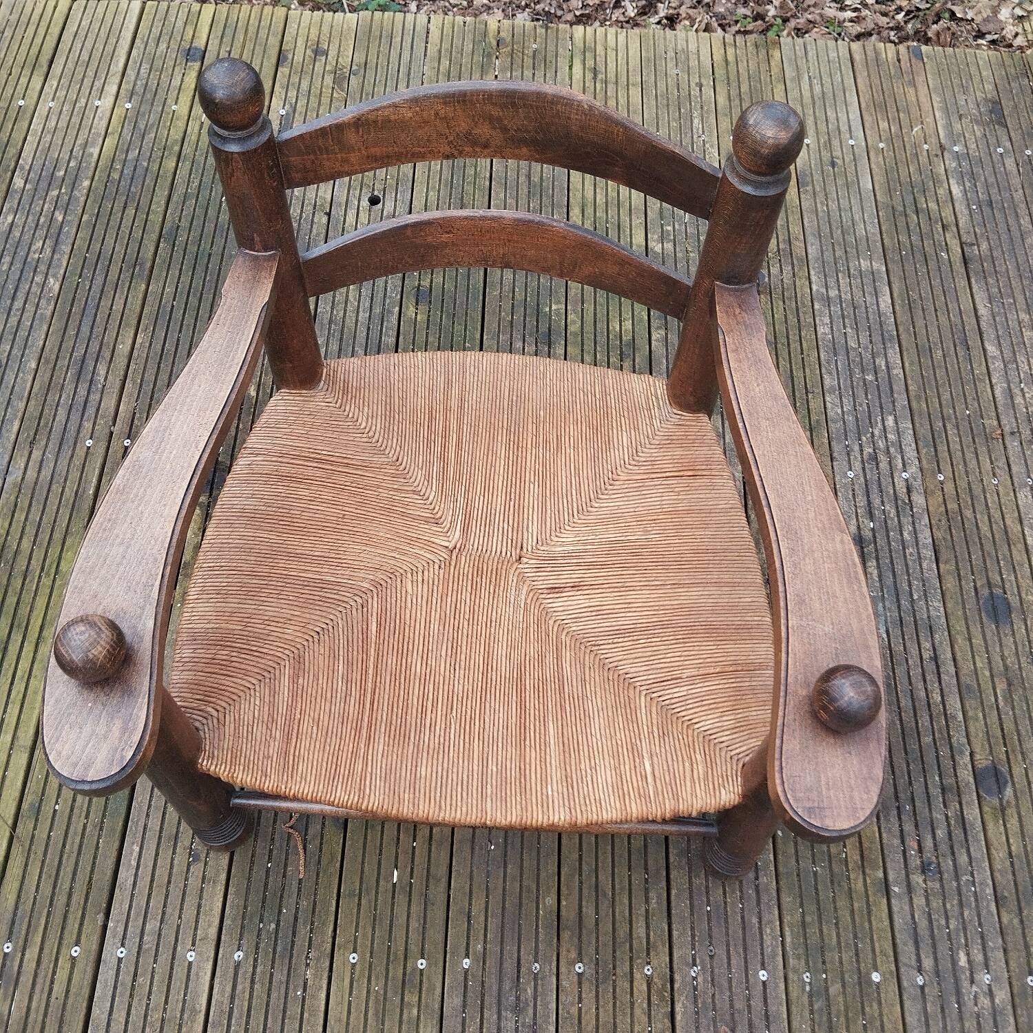 Low straw fireplace armchair in Dudouyt style