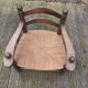 Low straw fireplace armchair in Dudouyt style