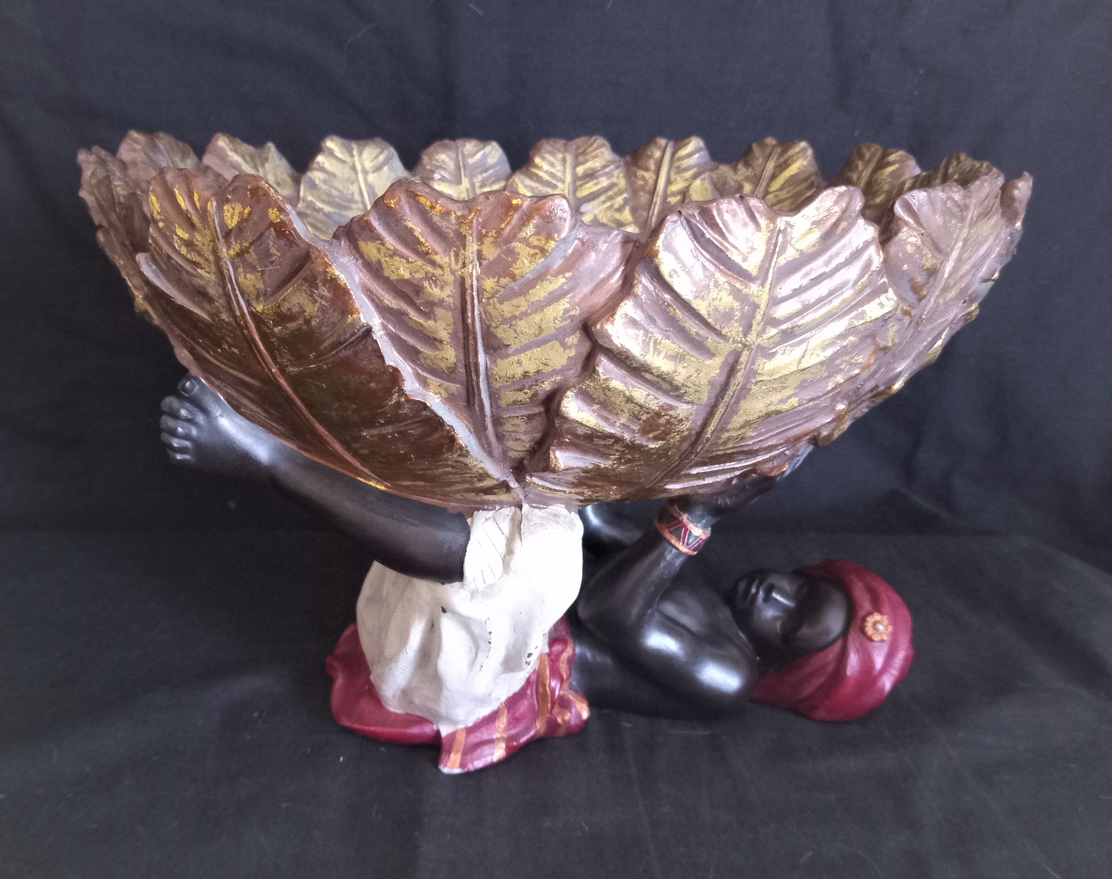 Centerpiece (empty pocket) in resin with African character