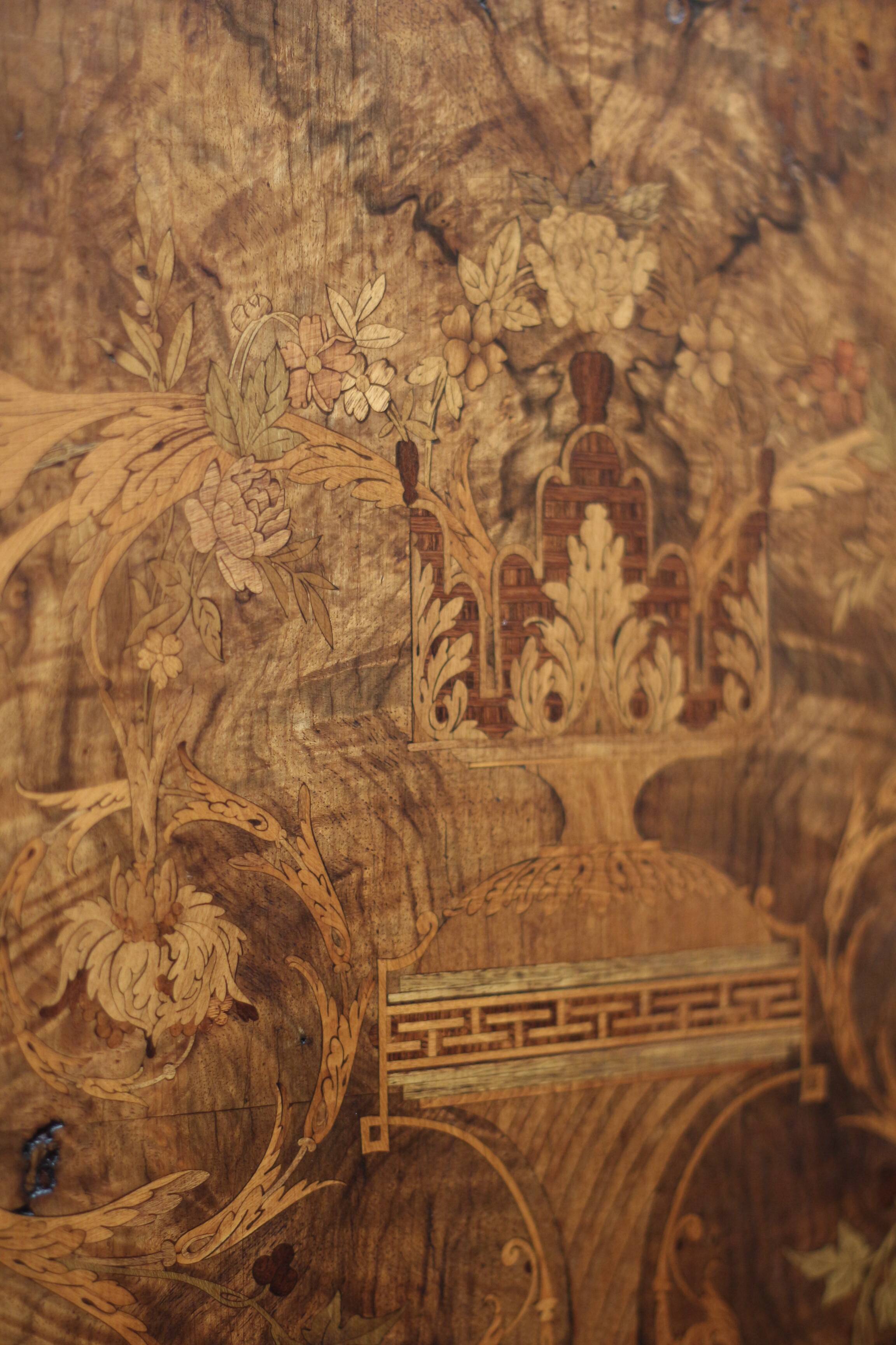 Superb Napoleon III table. Marquetry top and gilded bronzes.
