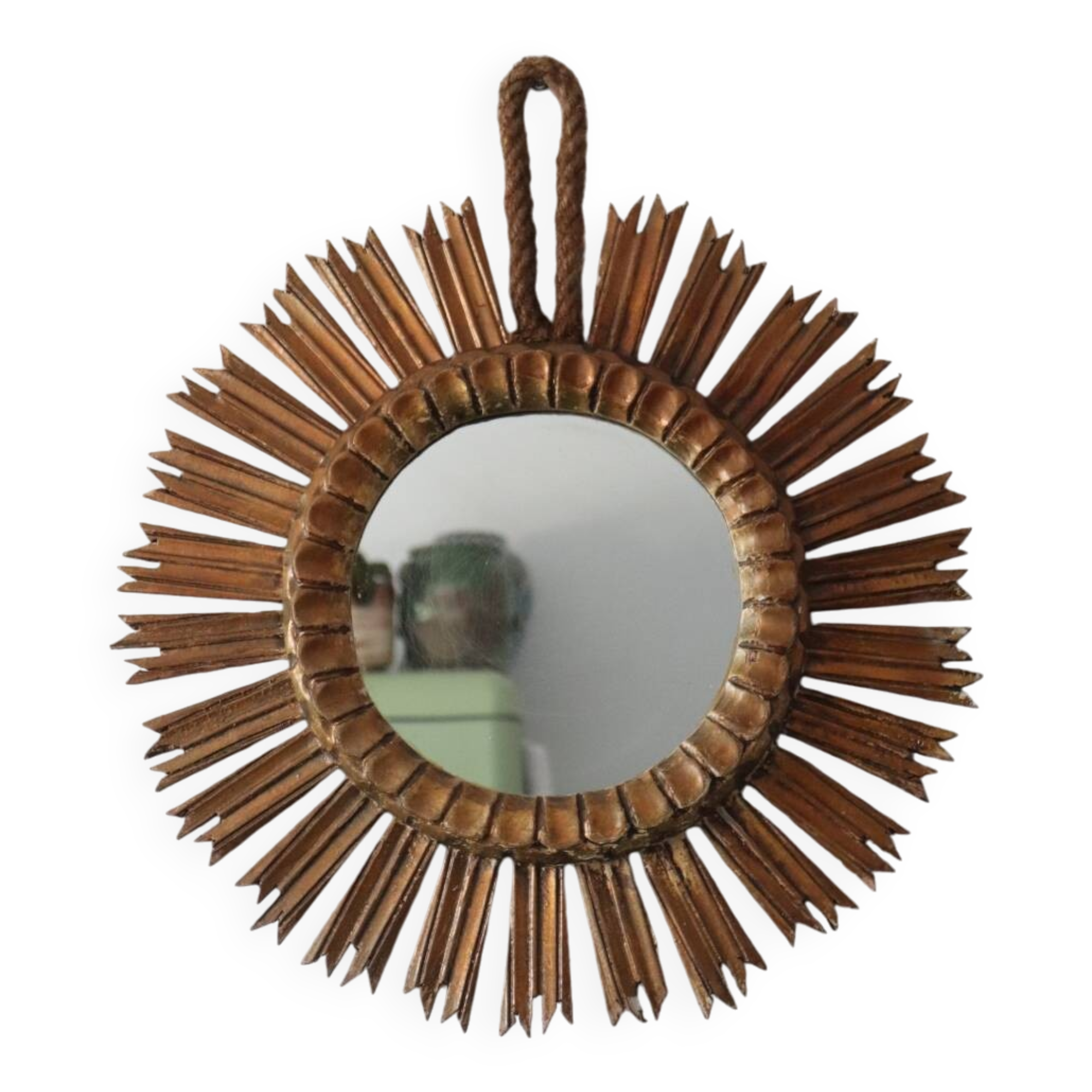 Old large sun mirror in gilded wood