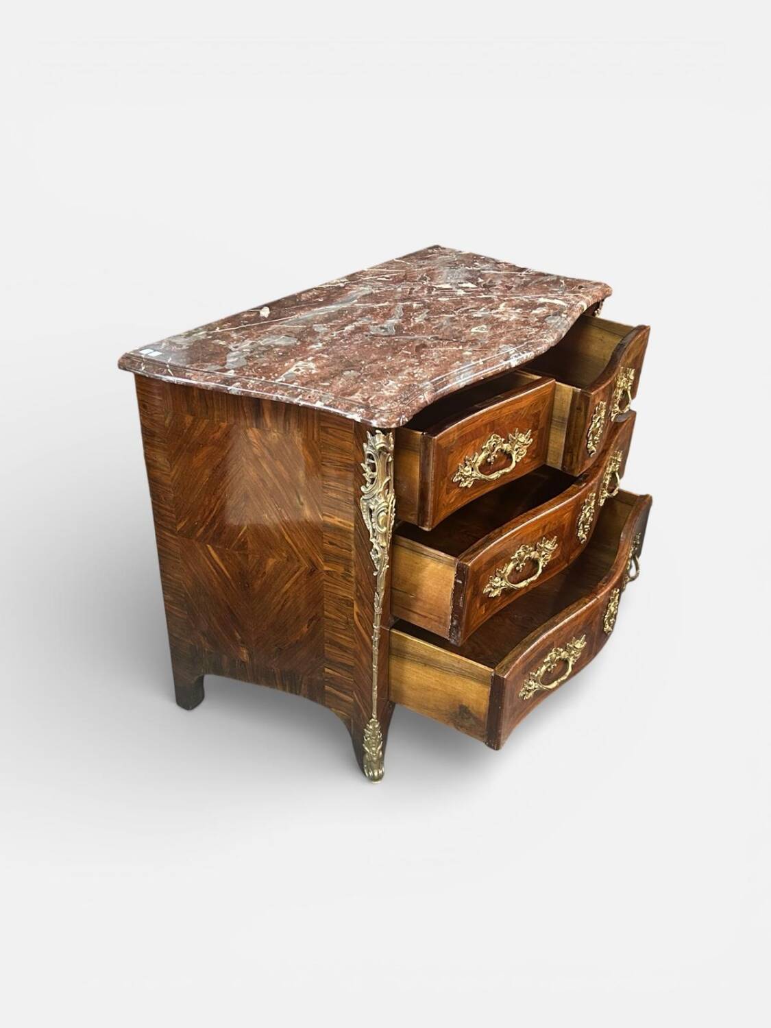 Louis XV period commode with violet wood veneer.