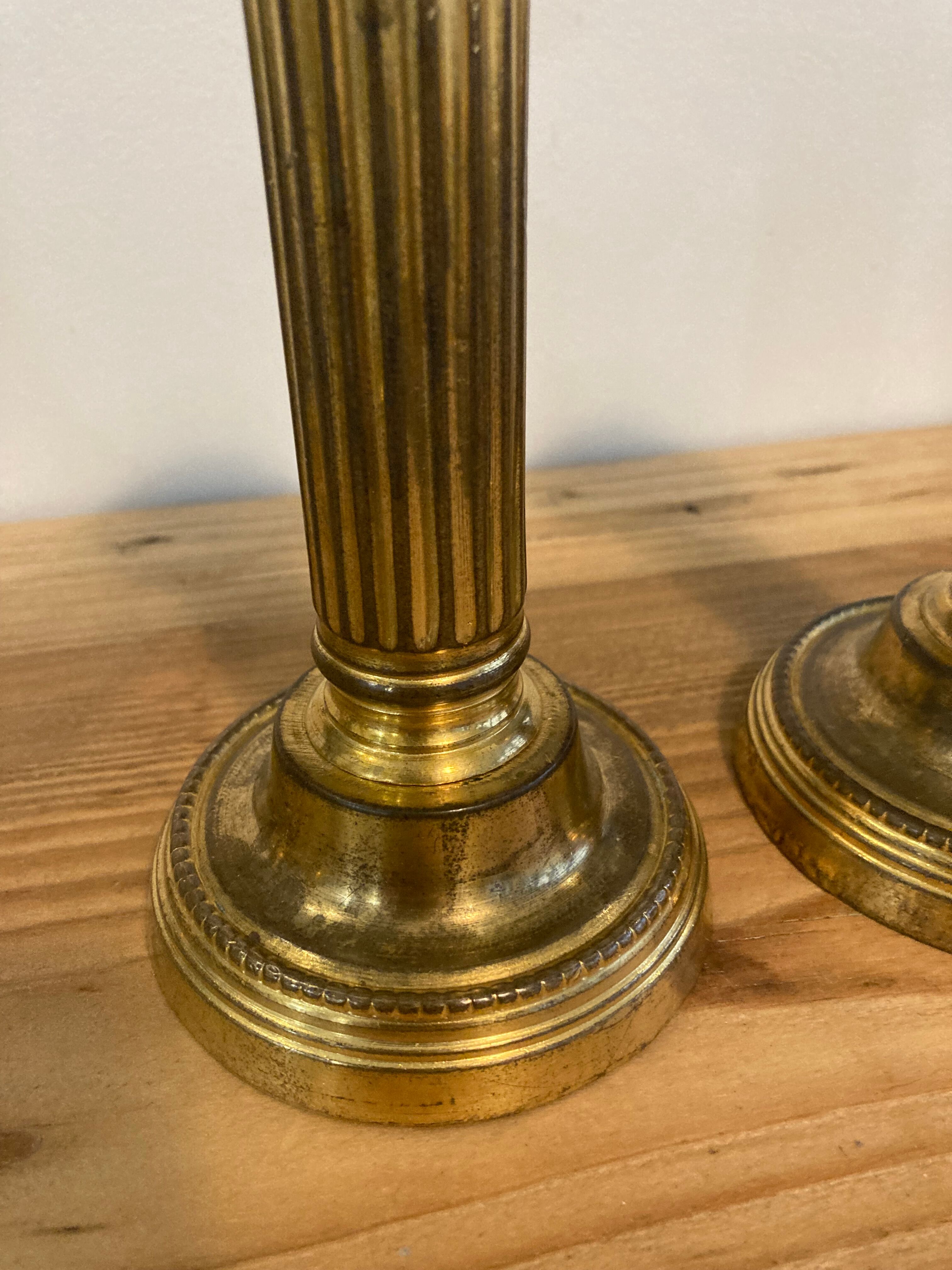 Pair of Louis XVI candlesticks in gilded bronze