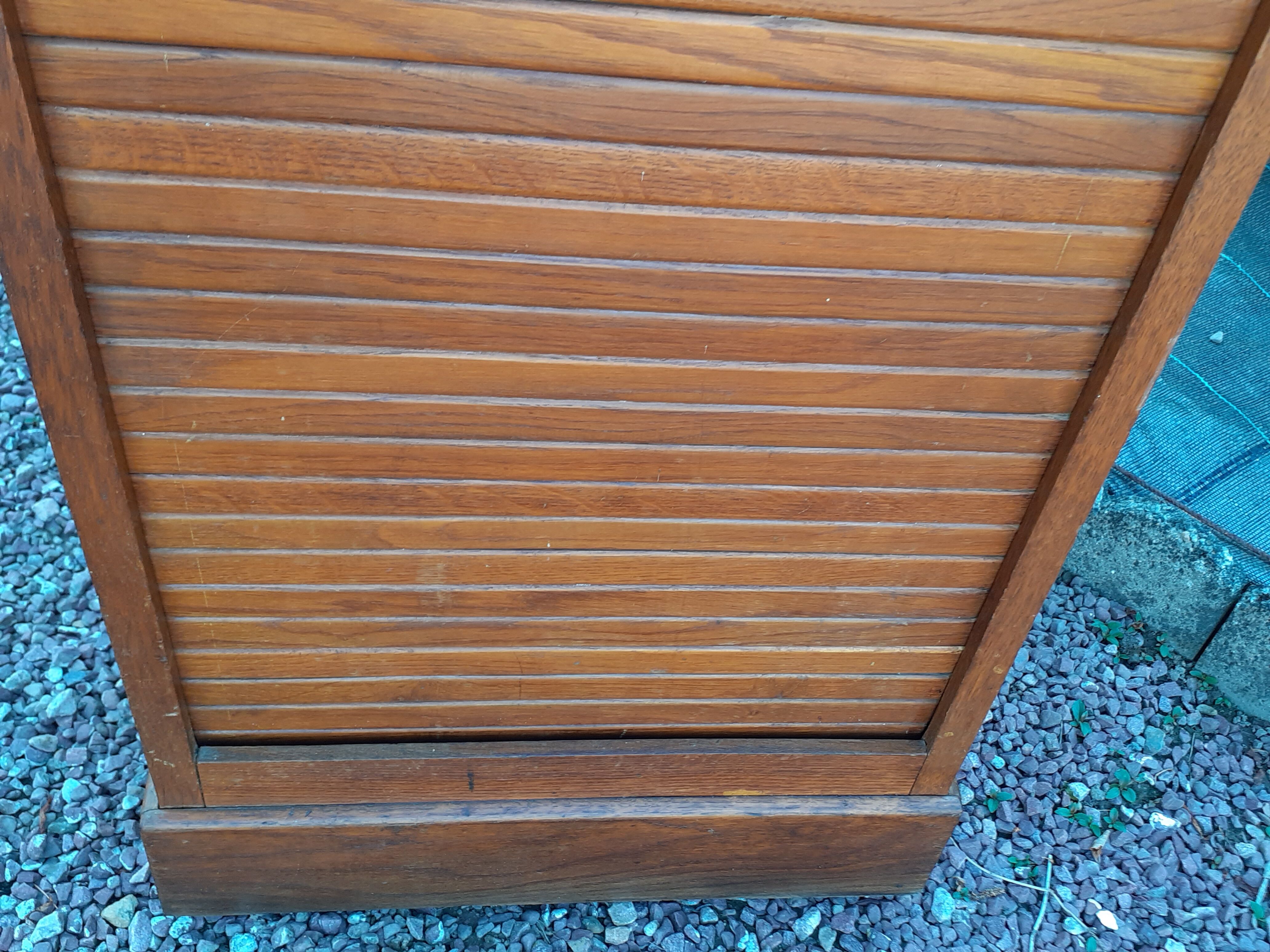 Storage cabinet locker with old wooden curtain