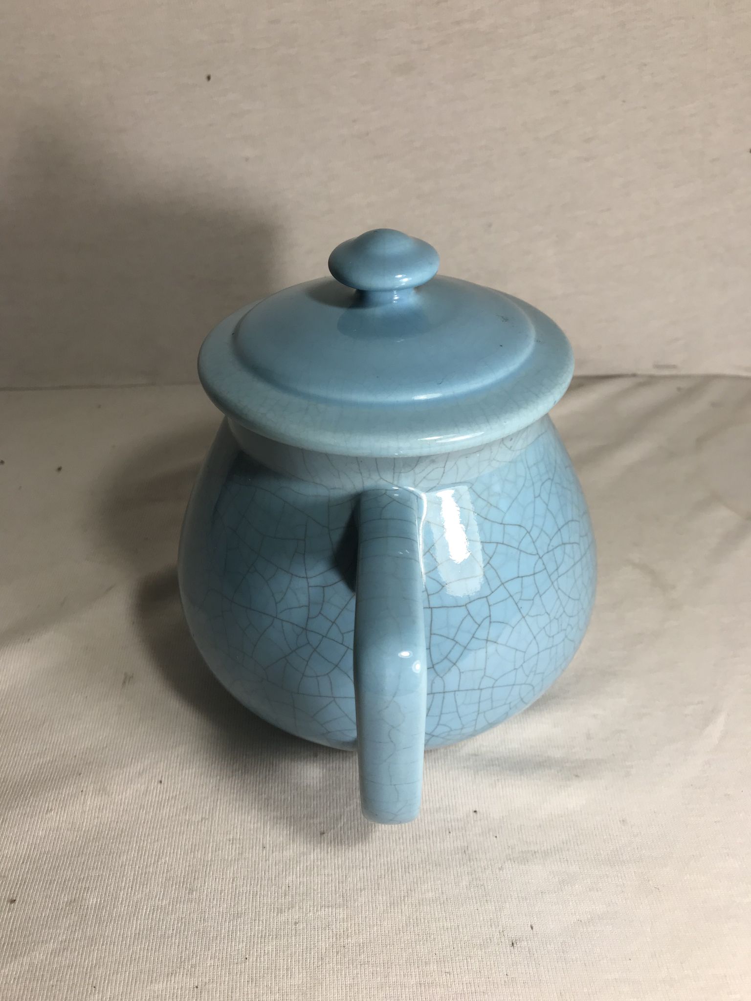 Cracked blue ceramic vintage teapot