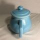 Cracked blue ceramic vintage teapot
