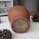 Old pitcher pitcher in varnished sandstone